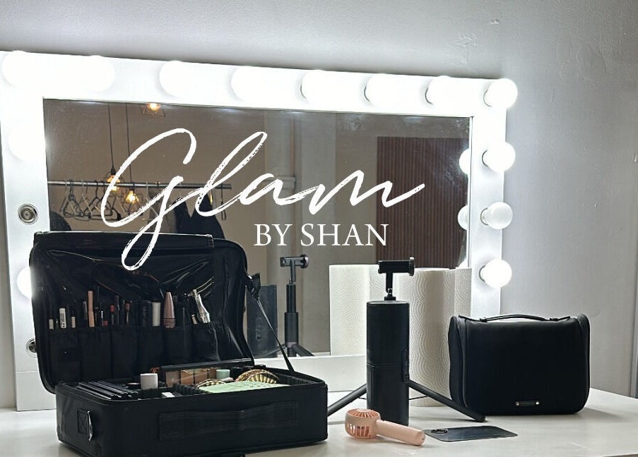 Makeup station at Glam By Shan, Newmarket, Ontario, CA, featuring a lit mirror and organized beauty tools.