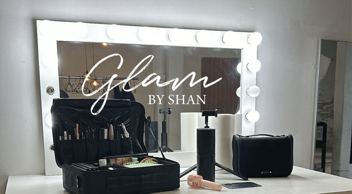 Makeup station at Glam By Shan, Newmarket, Ontario, CA, featuring a lit mirror and organized beauty tools.