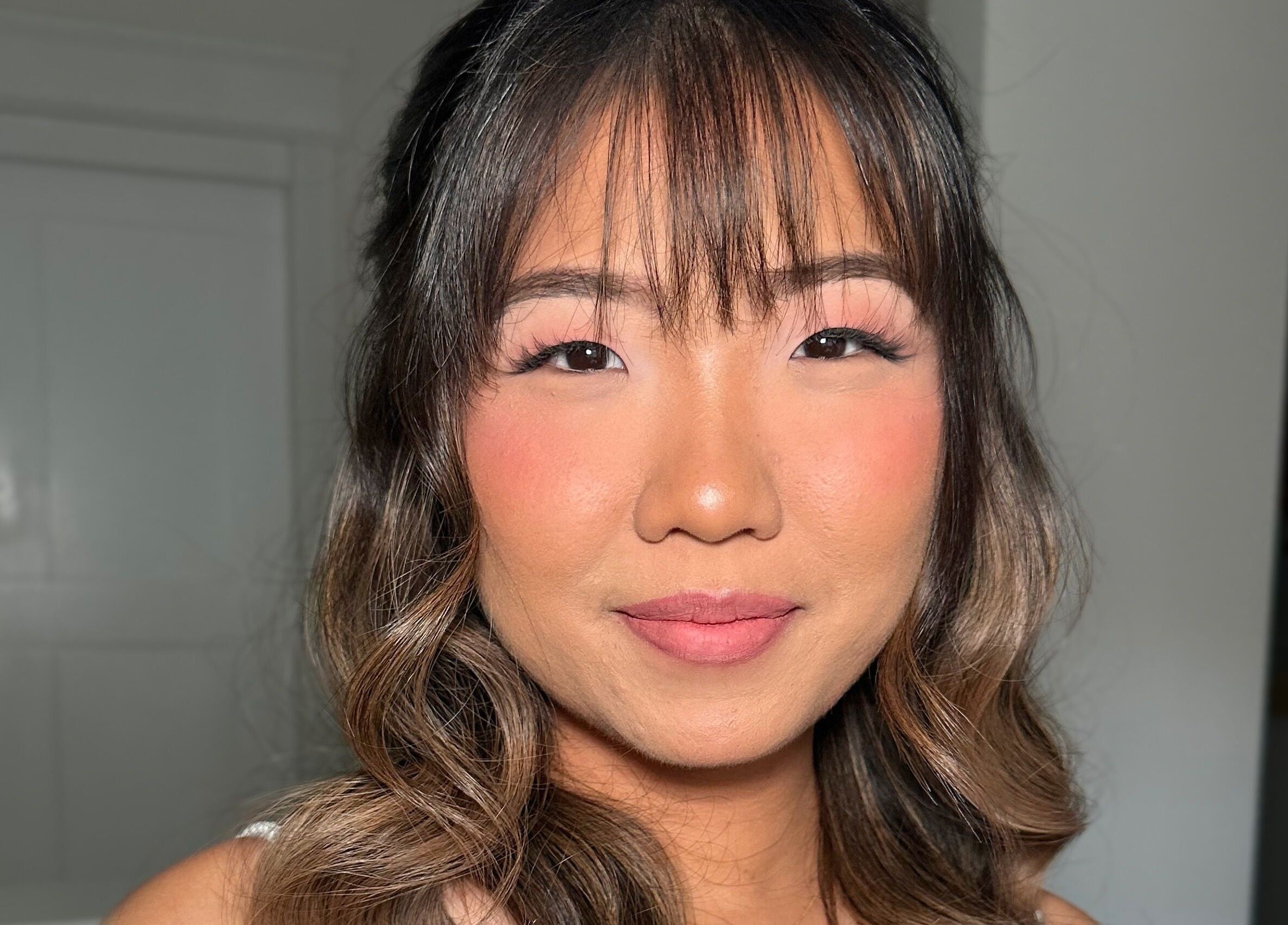 A client with flawless makeup and styled hair at Glam By Shan in Newmarket, Ontario, CA.