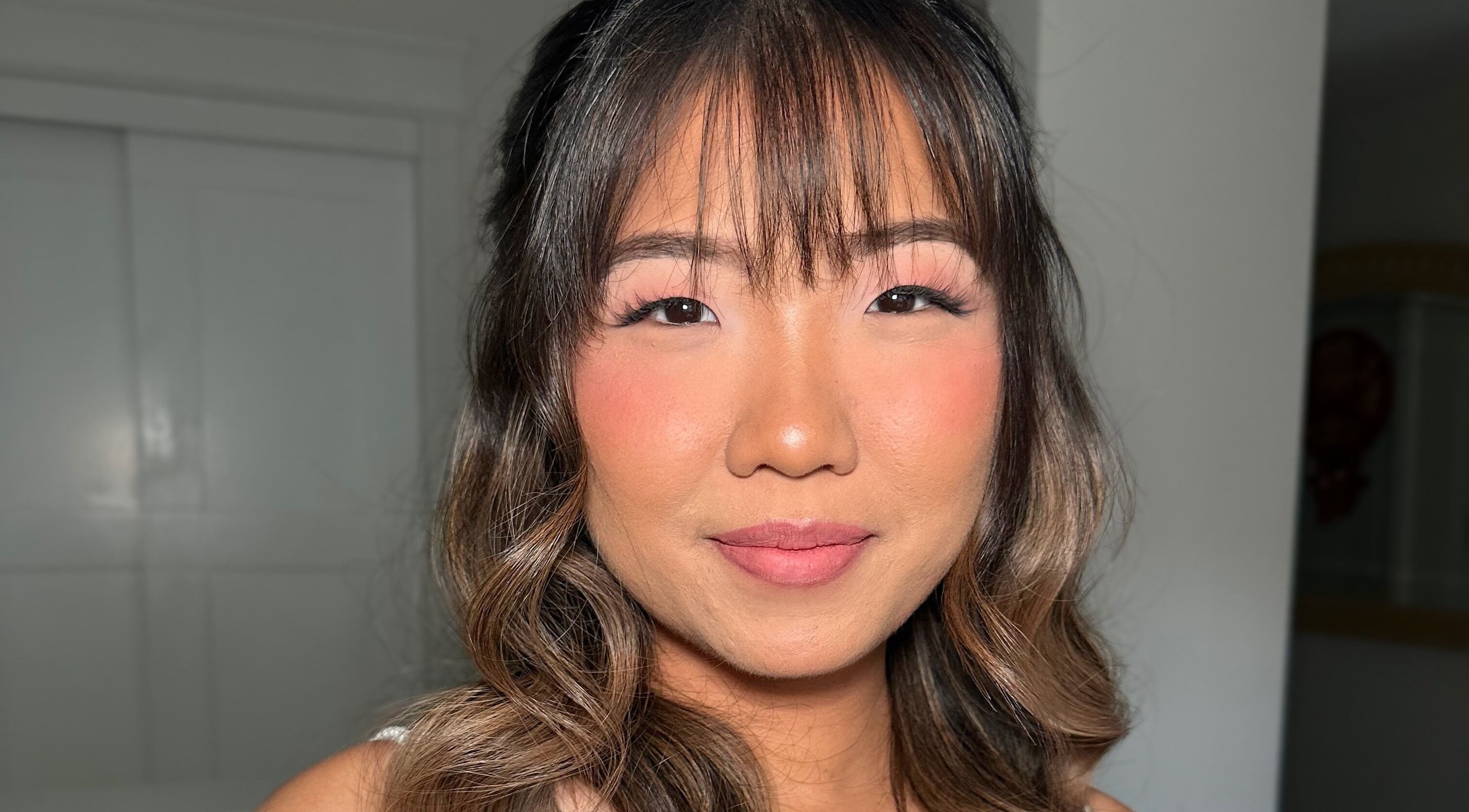 A client with flawless makeup and styled hair at Glam By Shan in Newmarket, Ontario, CA.