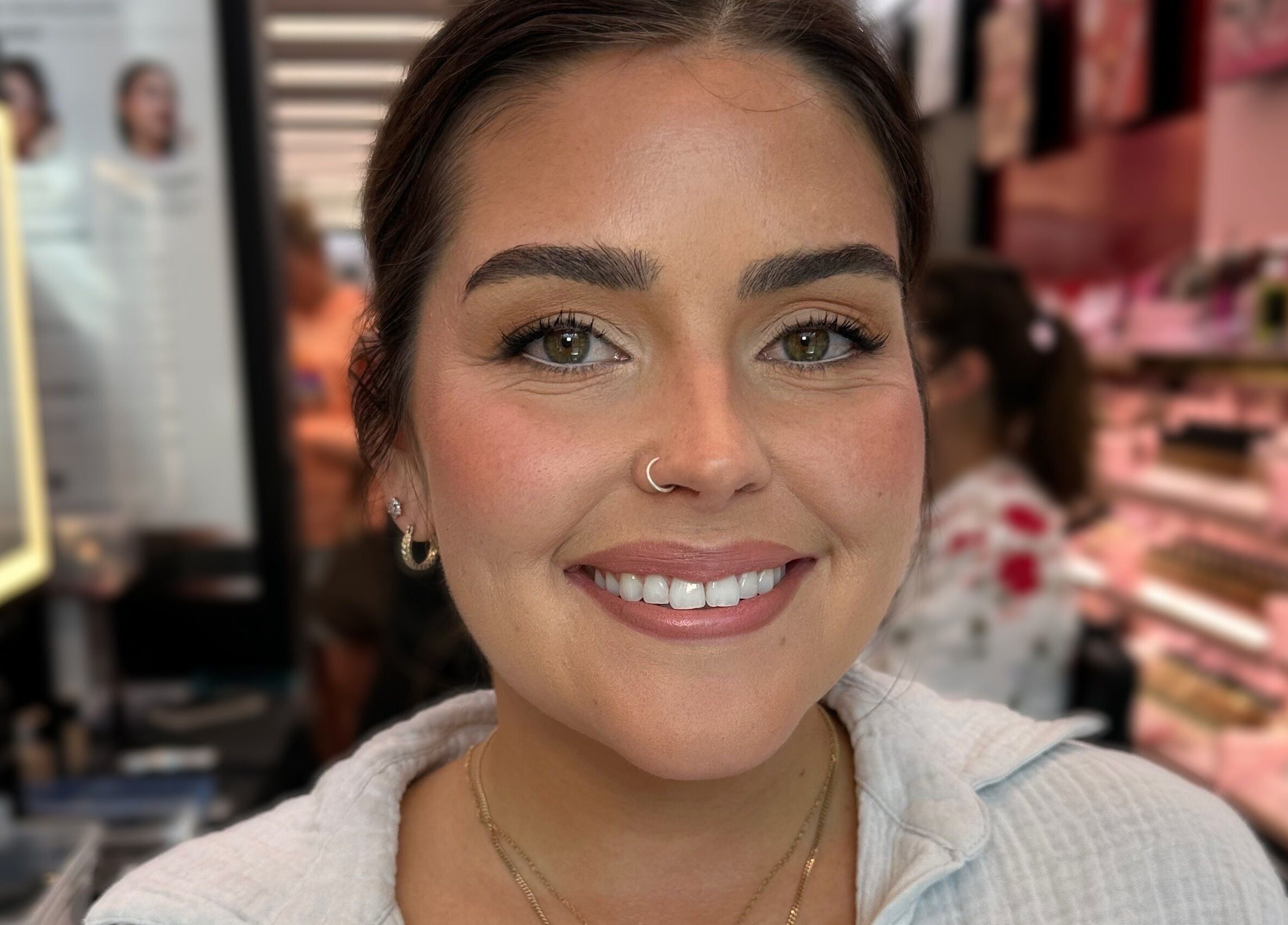 Happy customer at Glam By Shan in Newmarket, Ontario, CA with natural makeup and radiant smile.