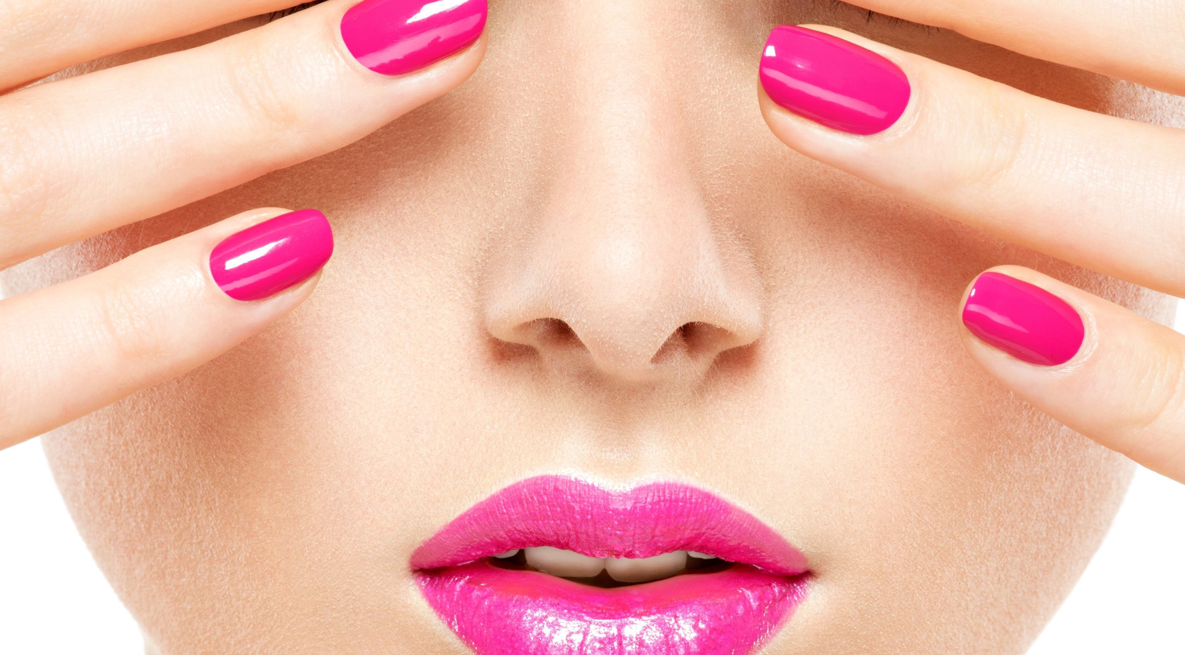 Close-up of vivid pink nails and lips. Haus of Skin, Klein Brak River, Western Cape, ZA.