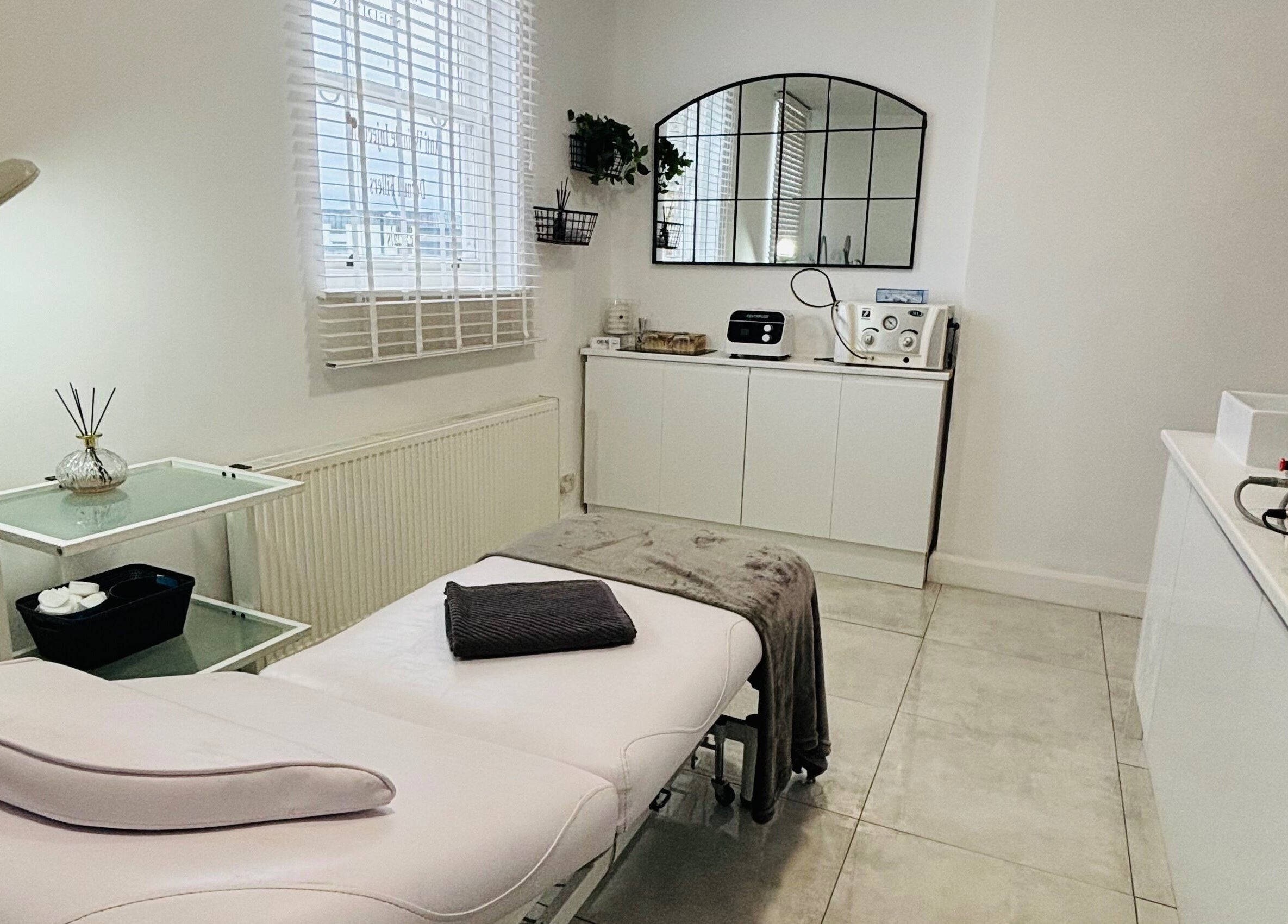 A tranquil treatment room at Another Level Medispa, Chelmsford, England, GB, showcasing a modern spa setup.