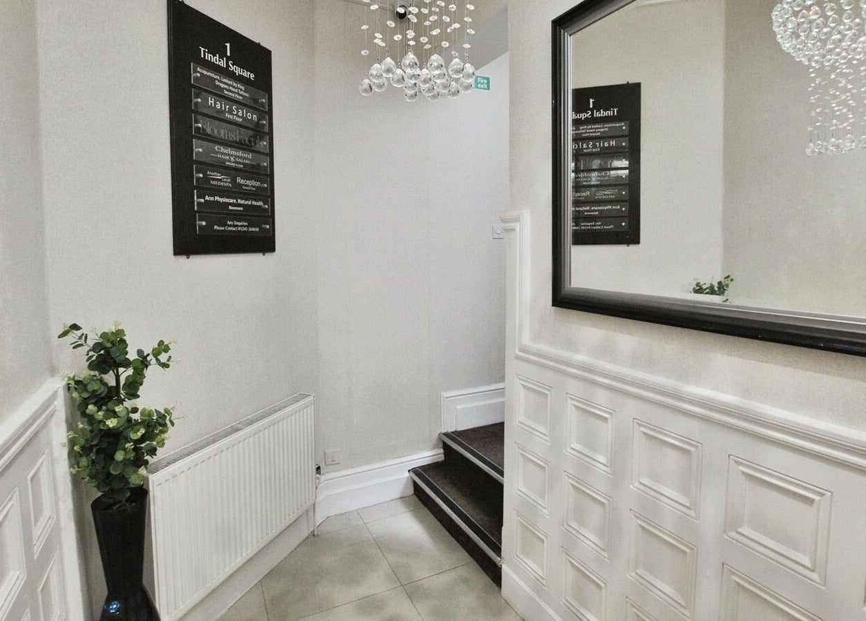 Entrance of Another Level Medispa, Chelmsford, England, GB with modern decor and chic lighting.
