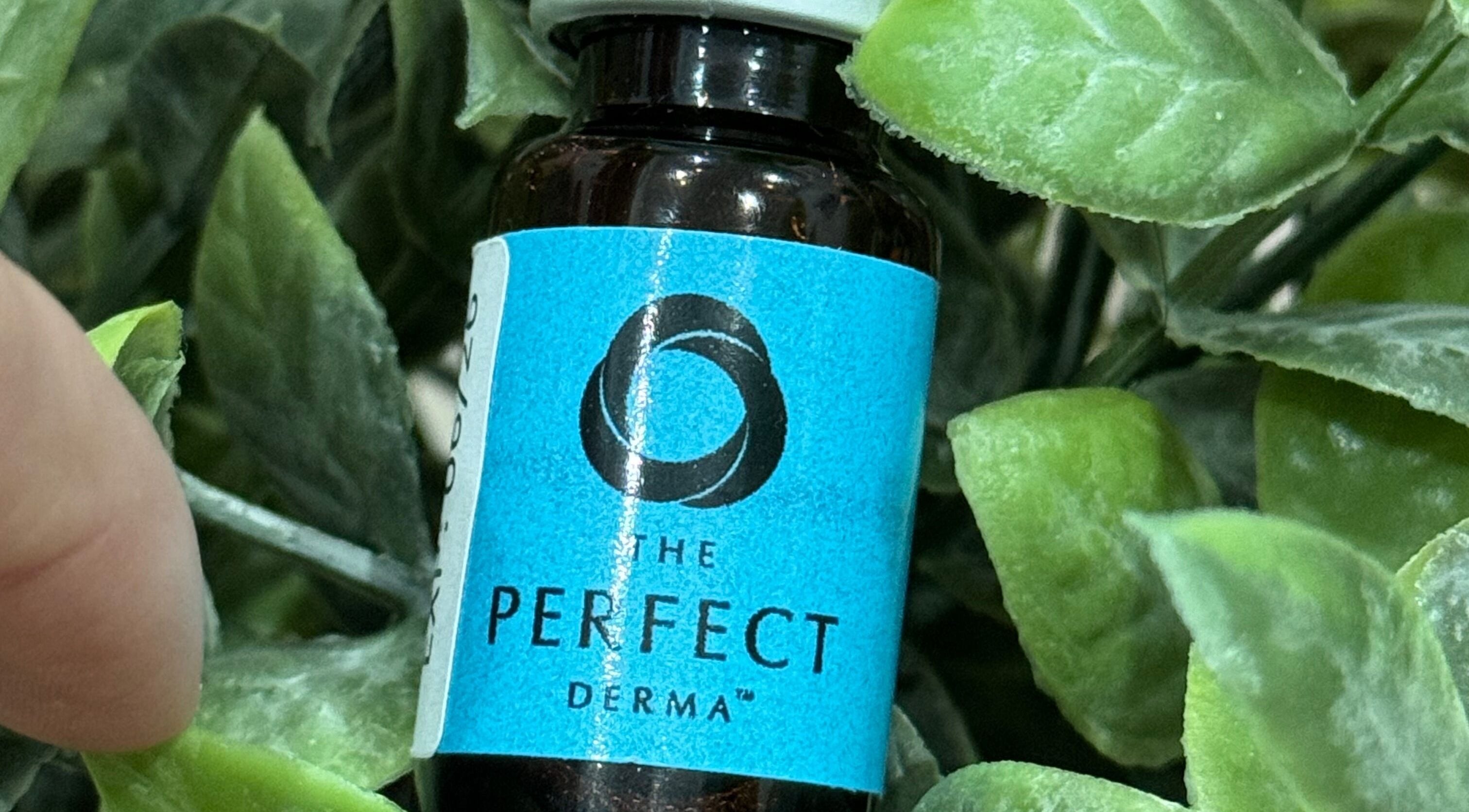 Close-up of a skincare bottle in a leafy setting at Serene Esthetics, Surrey, British Columbia, CA.