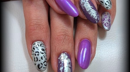 Vibrant purple and silver nail art at Nails and Beauty by Liz B, Barnsley, England, GB.