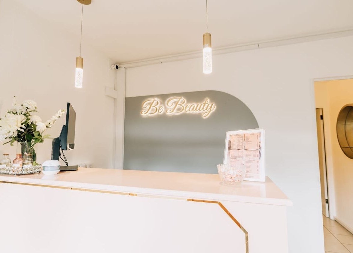 Reception area at Pure Essence Spa, Kralendijk, Bonaire, BQ with elegant decor and floral accents.