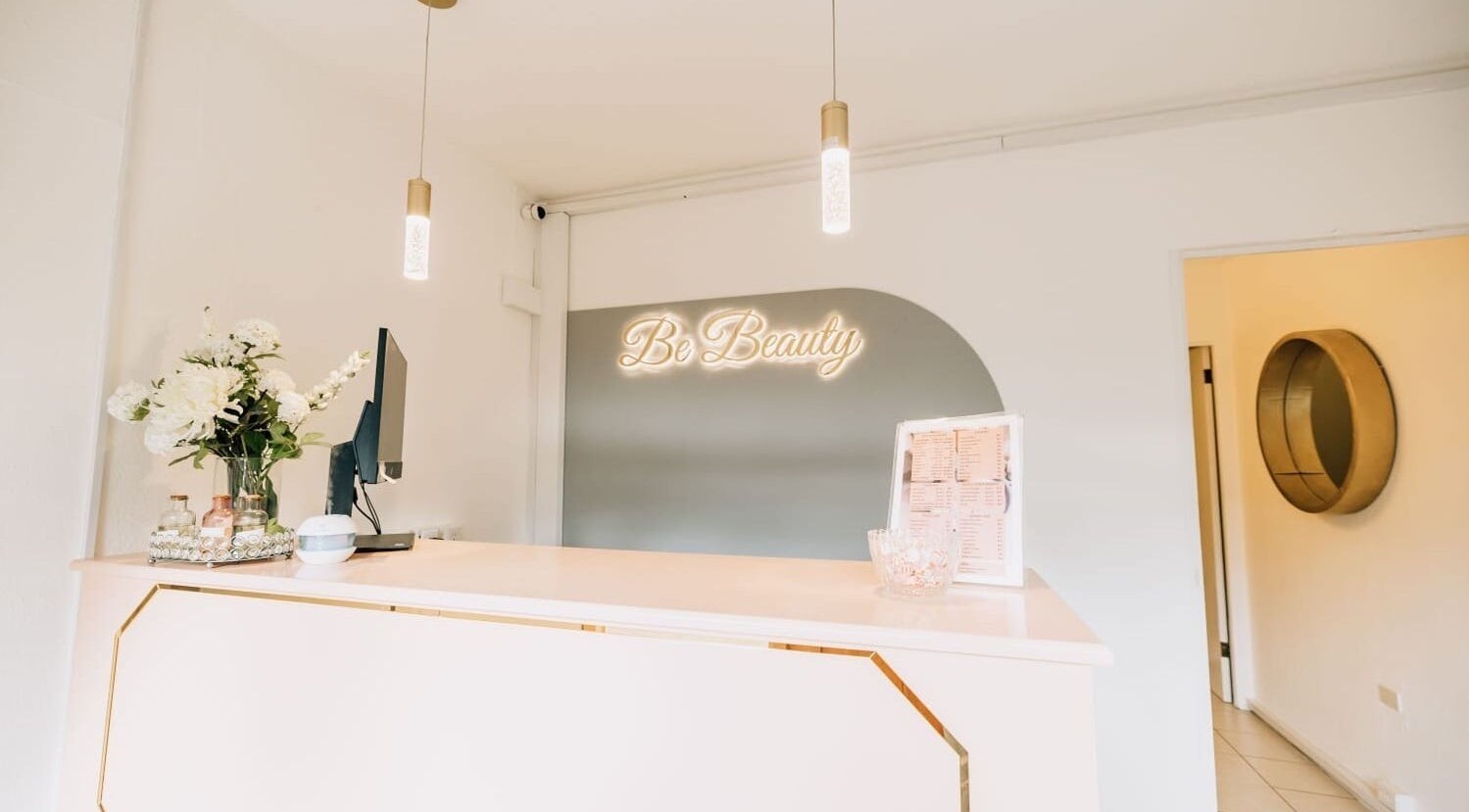 Reception area at Pure Essence Spa, Kralendijk, Bonaire, BQ with elegant decor and floral accents.