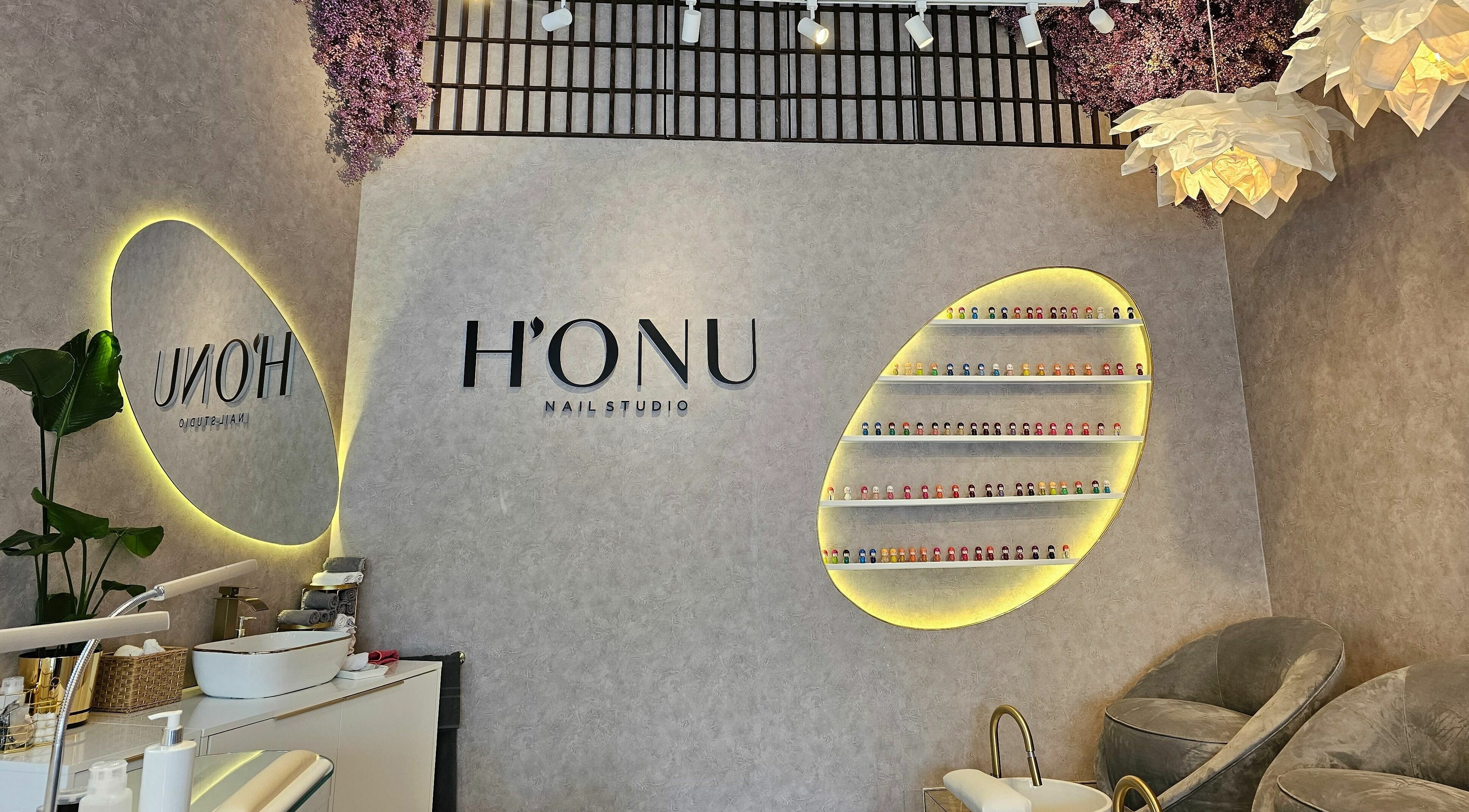 Elegant interior of Honu Nail Studio - West Hampstead, London, England, GB with sleek decor and accent lighting.