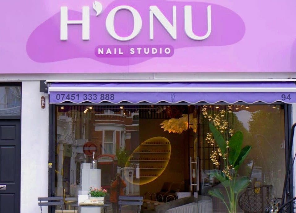 Honu Nail Studio - West Hampstead exterior in London, England, GB, with vibrant pink signage.