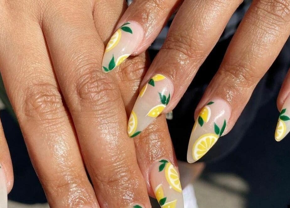 Vibrant citrus-themed nail art at Honu Nail Studio - West Hampstead in London, England, GB.