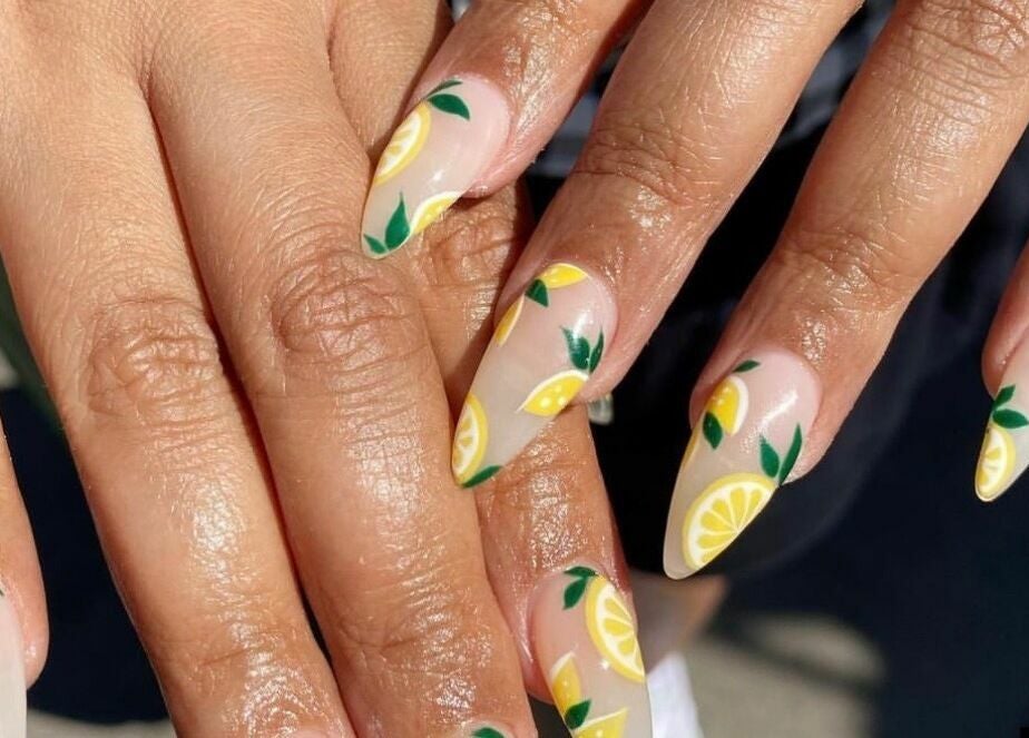 Vibrant citrus-themed nail art at Honu Nail Studio - West Hampstead in London, England, GB.