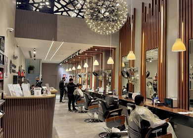 Inside view of The Address Barber | صالون العنوان القيروان in Riyadh, Riyadh Province, SA. Modern styling stations.