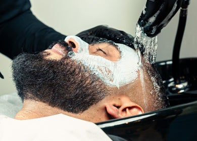 Man receiving beard wash at The Address Barber | صالون العنوان القيروان, Riyadh, Riyadh Province, SA.