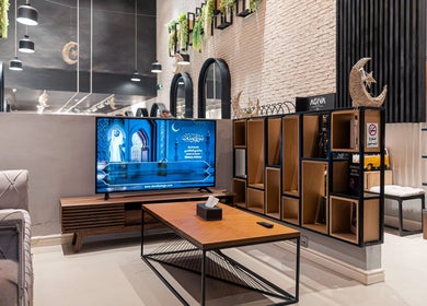 Cozy lounge area at The Address Barber | صالون العنوان اشبيليا, Riyadh, Riyadh Province, SA, with modern decor.