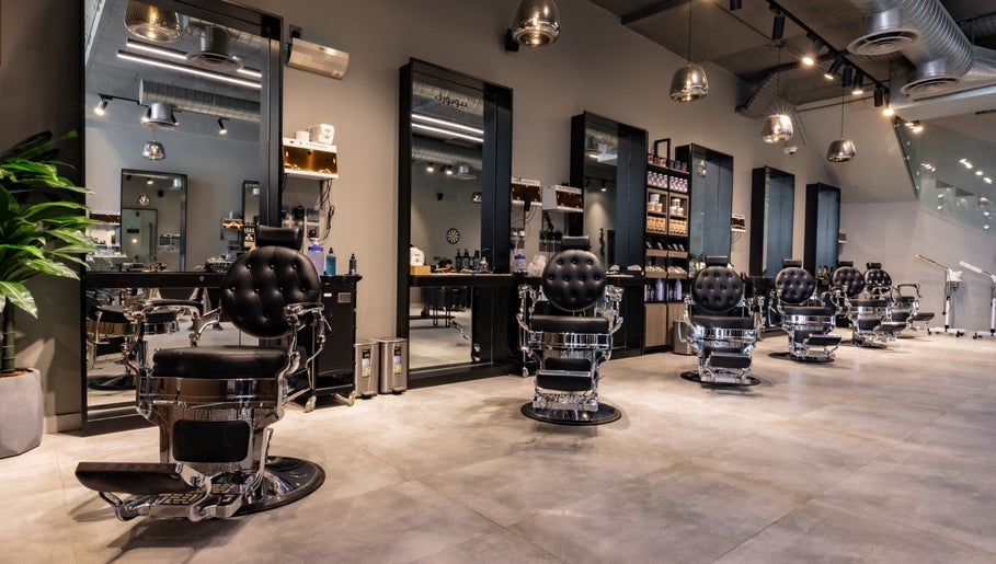 Stylish interior of The Address Barber | صالون العنوان الملقا in Riyadh, Riyadh Province, SA featuring classic barber chairs.