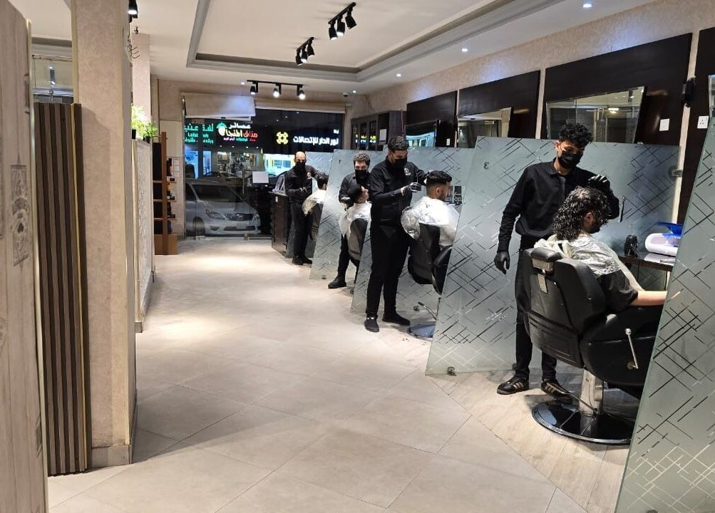 Modern interior at The Address Barber | صالون العنوان المونسيه, Riyadh, Riyadh Province, SA with stylists at work.