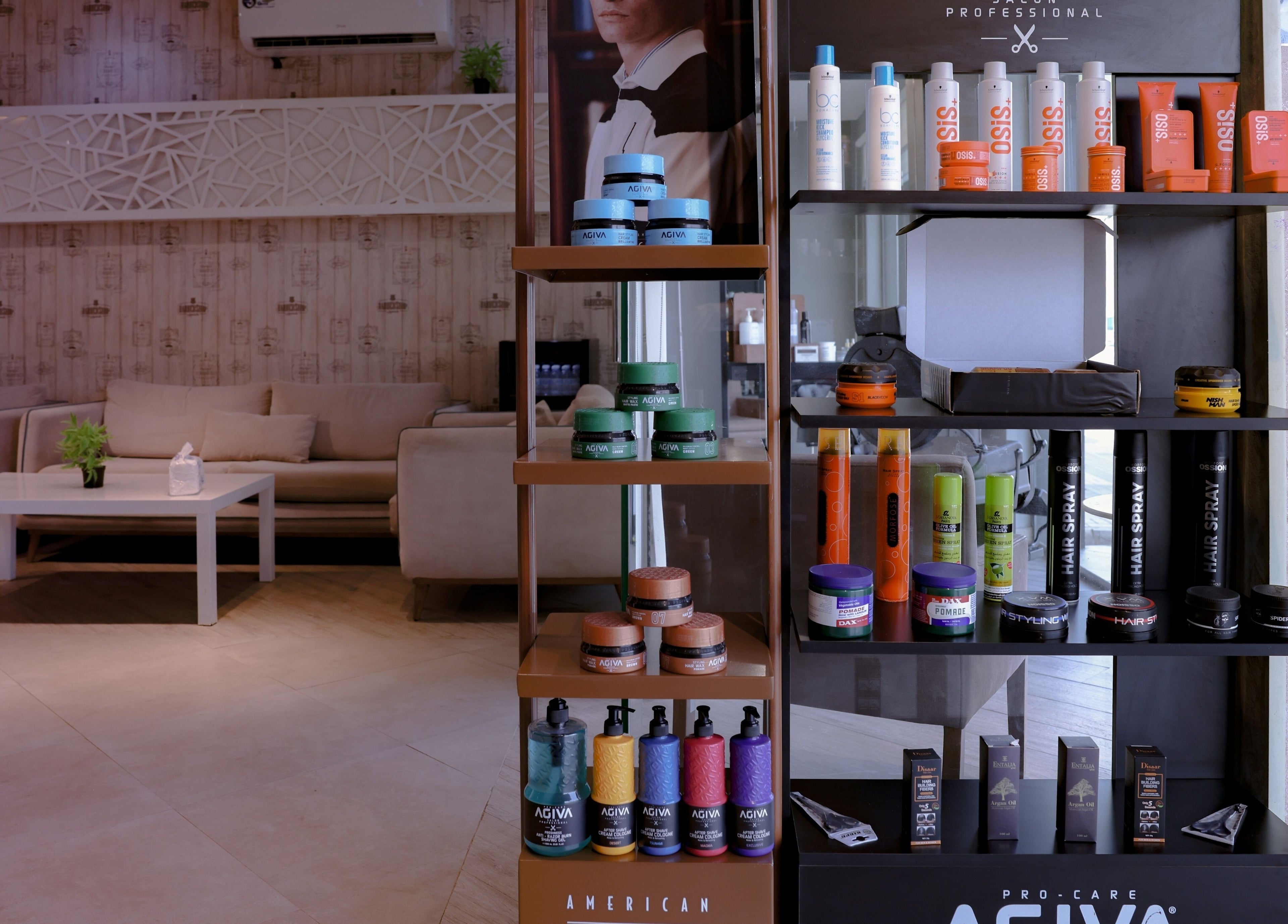 The Address Barber | صالون العنوان الروضة in Riyadh, SA offers a stylish product display in a cozy salon setting.