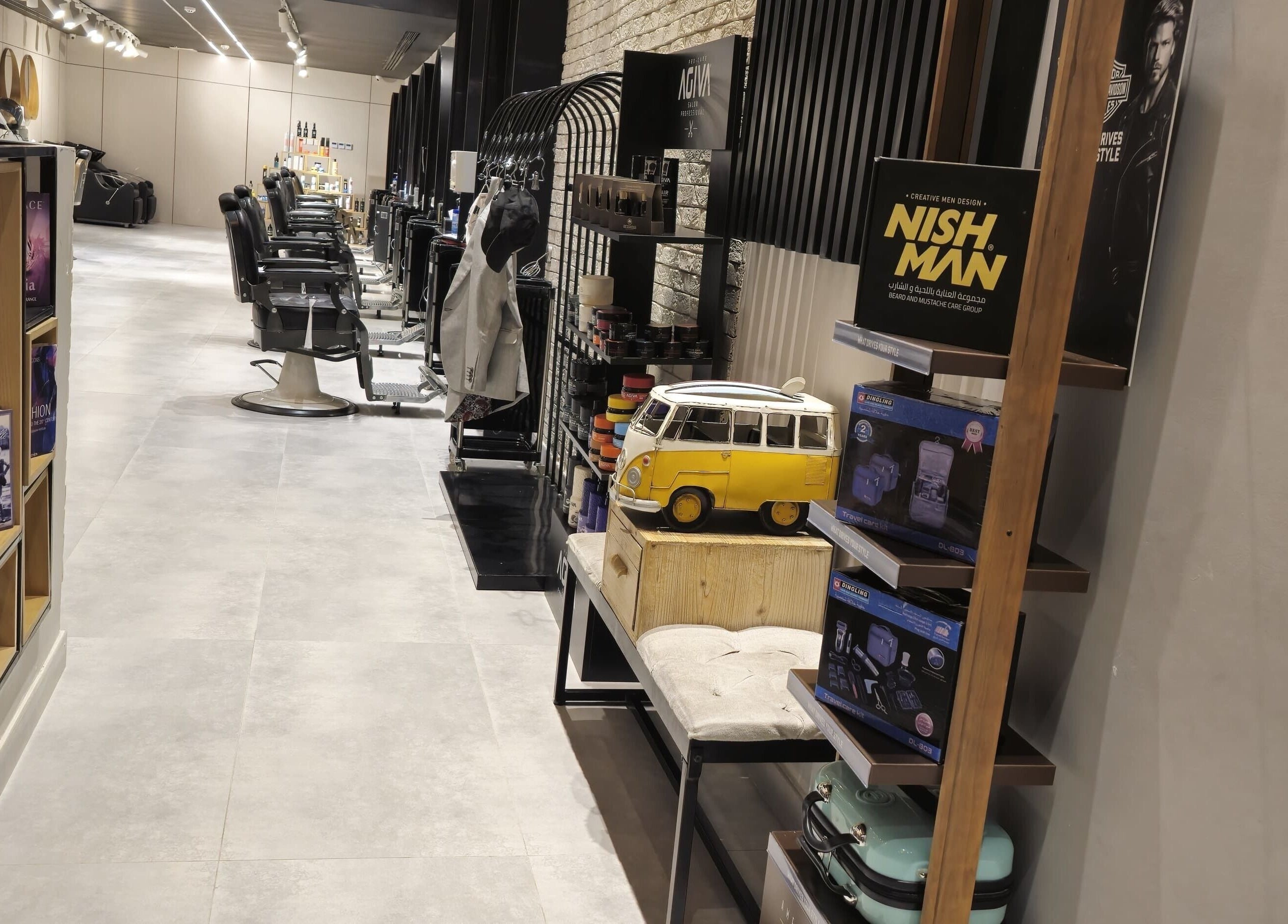 Modern interior of The Address Barber | صالون العنوان اشبيليا in Riyadh, Riyadh Province, SA with styled barber chairs.