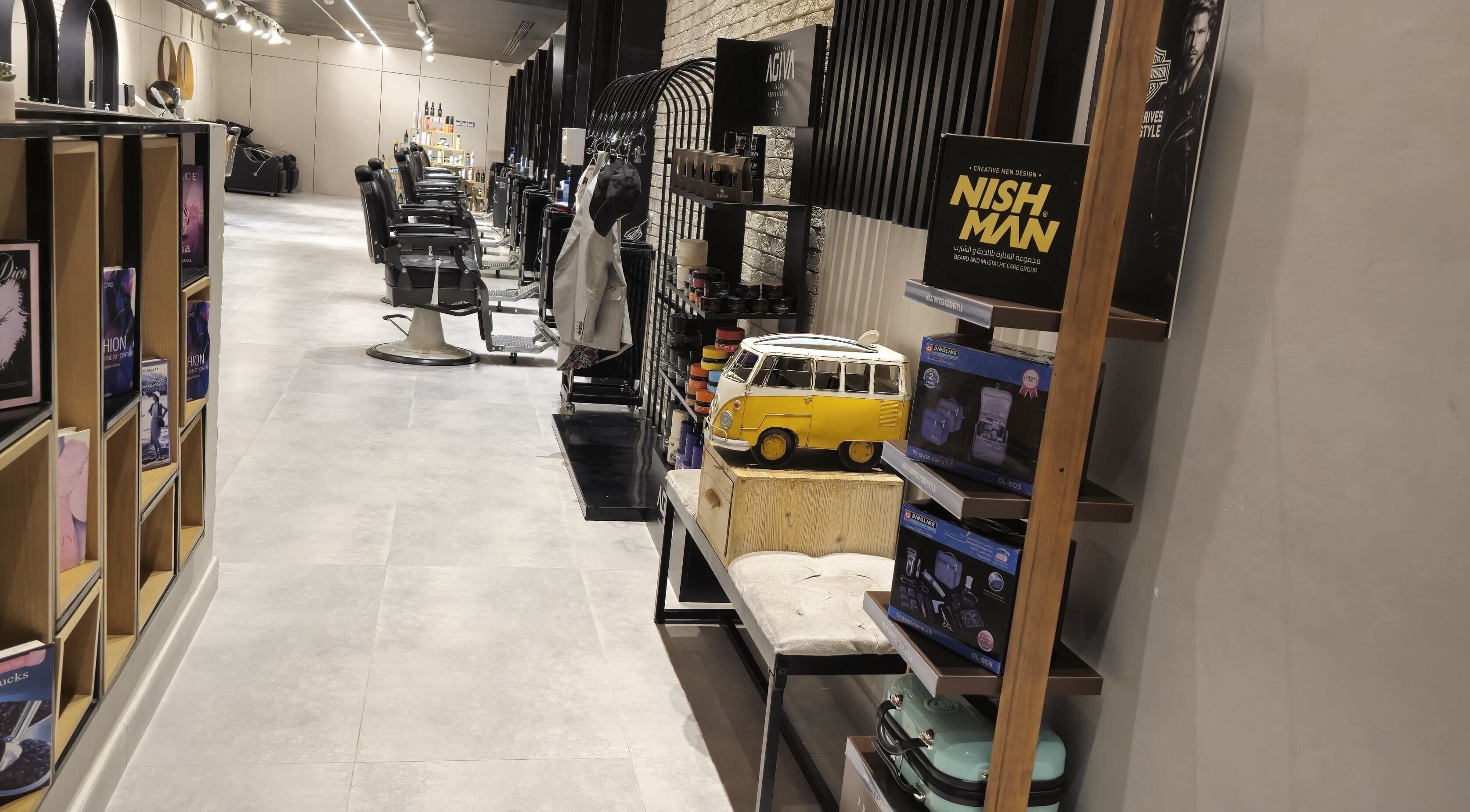 Modern interior of The Address Barber | صالون العنوان اشبيليا in Riyadh, Riyadh Province, SA with styled barber chairs.