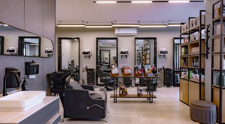 Modern interior of The Address Barber | صالون العنوان النزهة in Riyadh, Riyadh Province, SA, showcasing sleek styling stations.