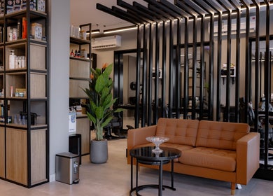 Stylish interior of The Address Barber | صالون العنوان النزهة, Riyadh, Riyadh Province, SA featuring sleek furniture.