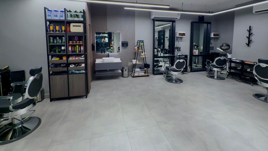 Modern interior of The Address Barber | صالون العنوان الغدير in Riyadh, Riyadh Province, SA with sleek chairs.