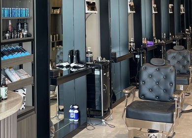 Chic interior of The Address Barber | صالون العنوان العارض in Riyadh, Riyadh Province, SA, showcasing seating and products.