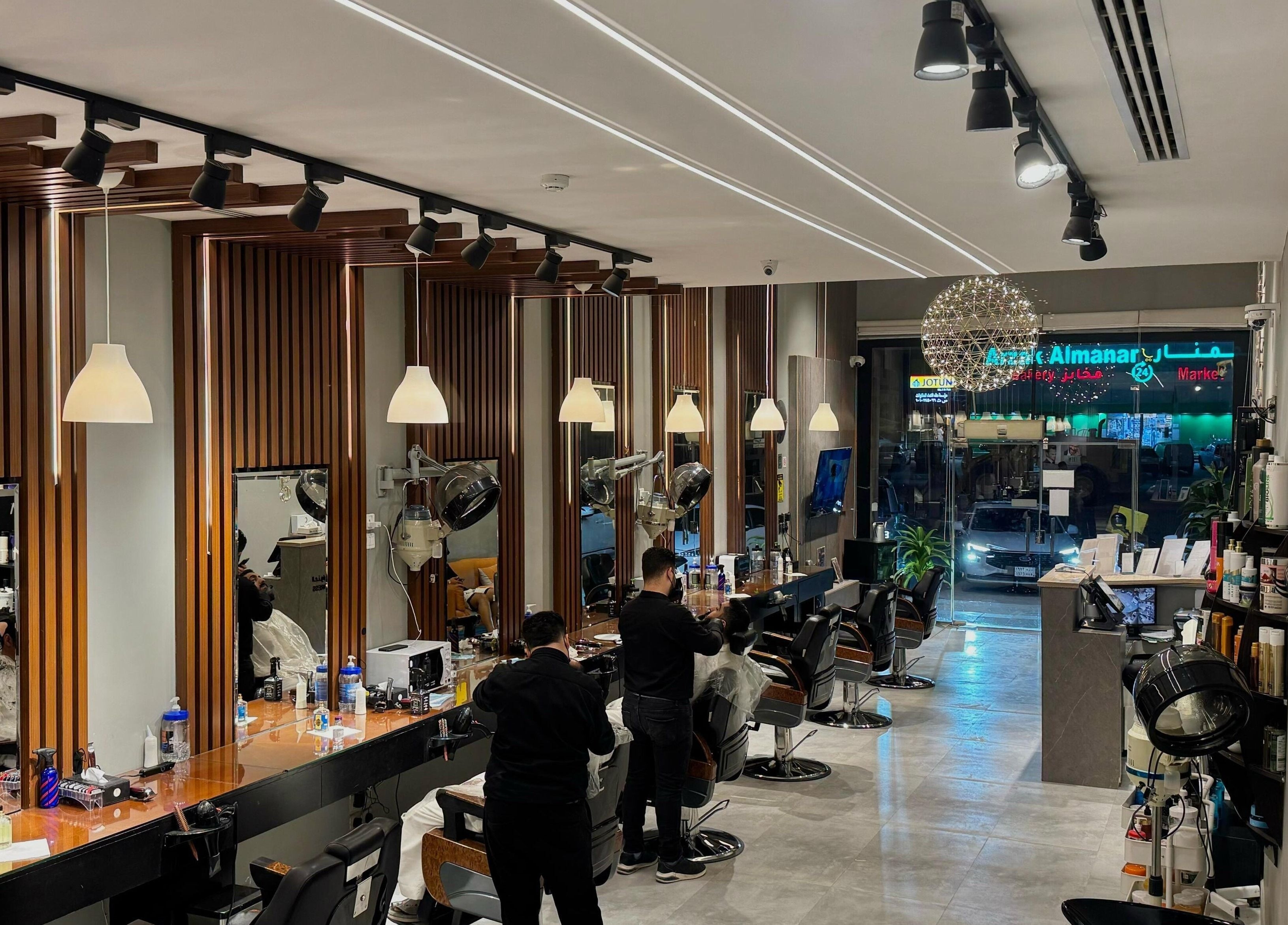 Interior of The Address Barber | صالون العنوان القيروان in Riyadh, showcasing modern design and stylish ambiance.