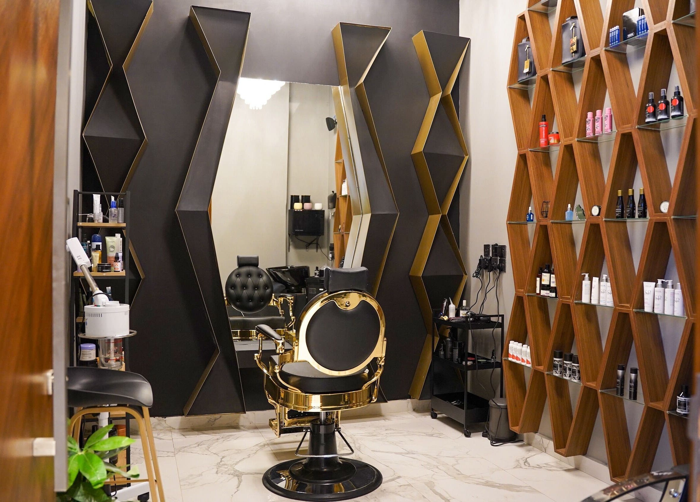 Elegant interior of The Address Barber | صالون العنوان الملقا in Riyadh, SA featuring luxury chair and stylish decor.