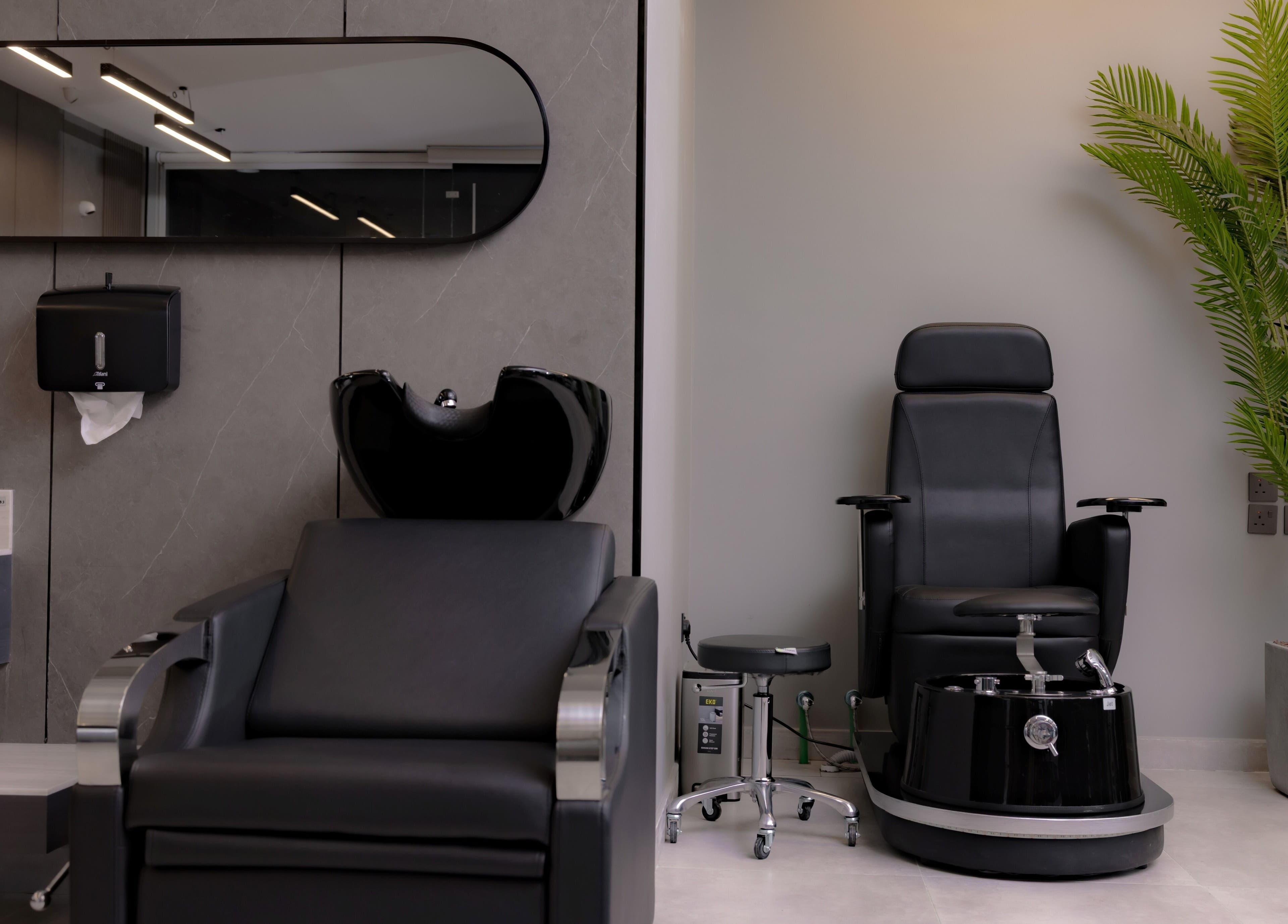 Modern barber chairs at The Address Barber | صالون العنوان النزهة, Riyadh, Riyadh Province, SA, showcasing elegance.