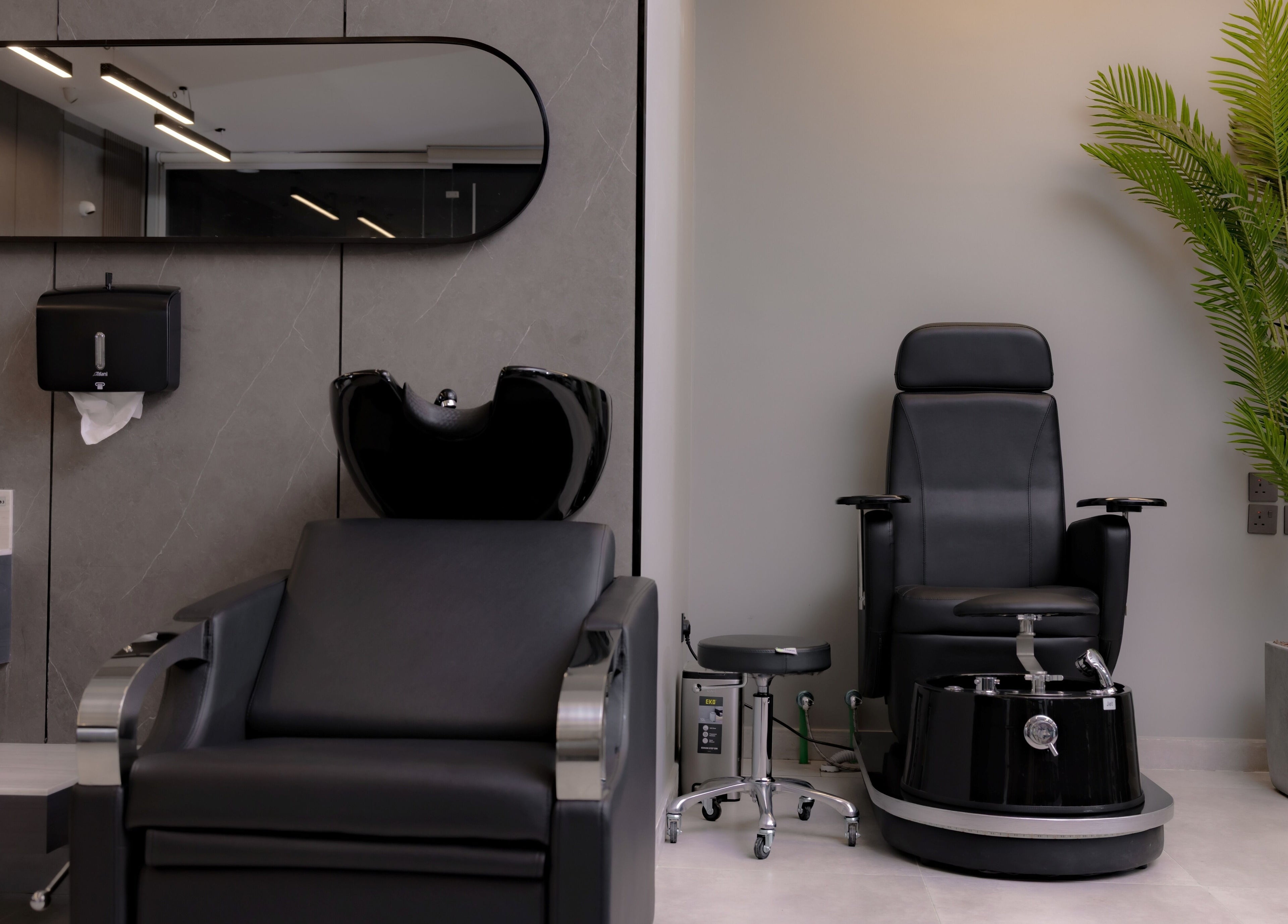 Modern barber chairs at The Address Barber | صالون العنوان النزهة, Riyadh, Riyadh Province, SA, showcasing elegance.