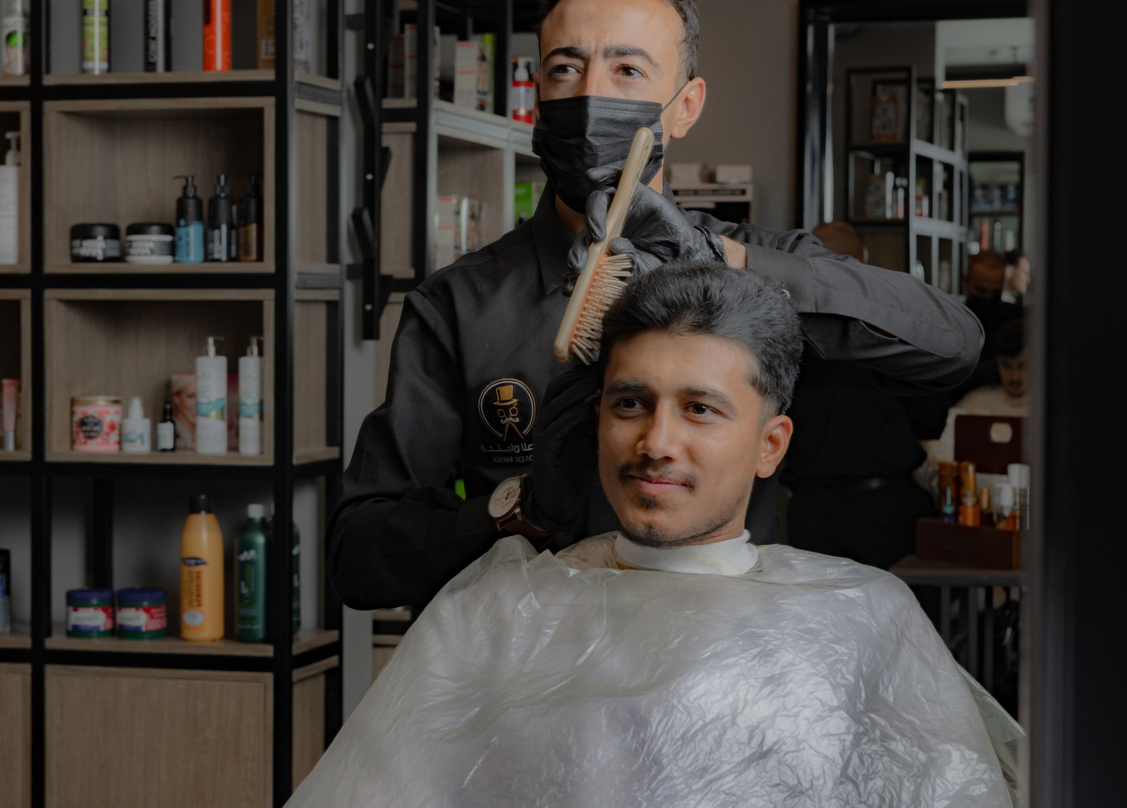 A client receives a premium haircut at The Address Barber | صالون العنوان النزهة, Riyadh, Riyadh Province, SA.