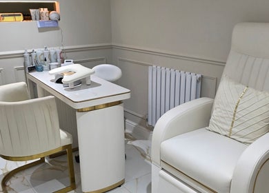 Elegant beauty treatment area at CDT Beauty, Morecambe, England, GB featuring plush seating and modern decor.