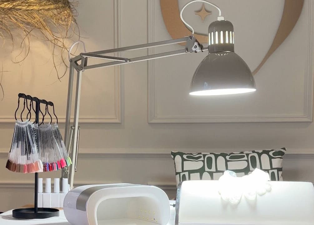 Cozy nail art station at Ocean Bloom - Troon, Camborne, England, GB with modern lighting and equipment.