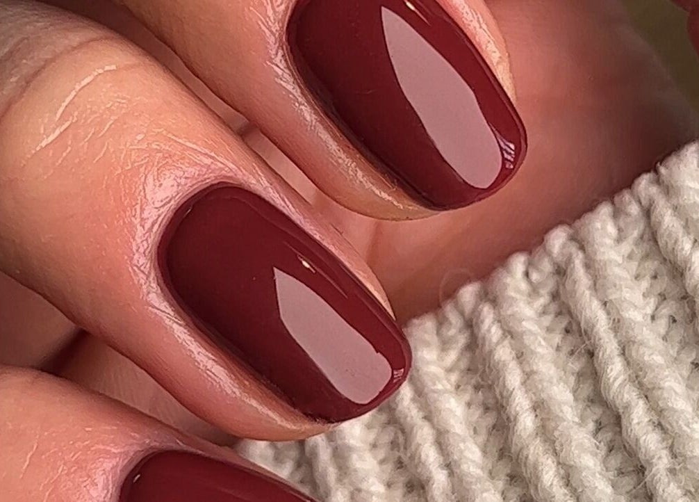 Elegant crimson manicure at Ocean Bloom - Troon, Camborne, England, GB, showcasing glossy perfection.