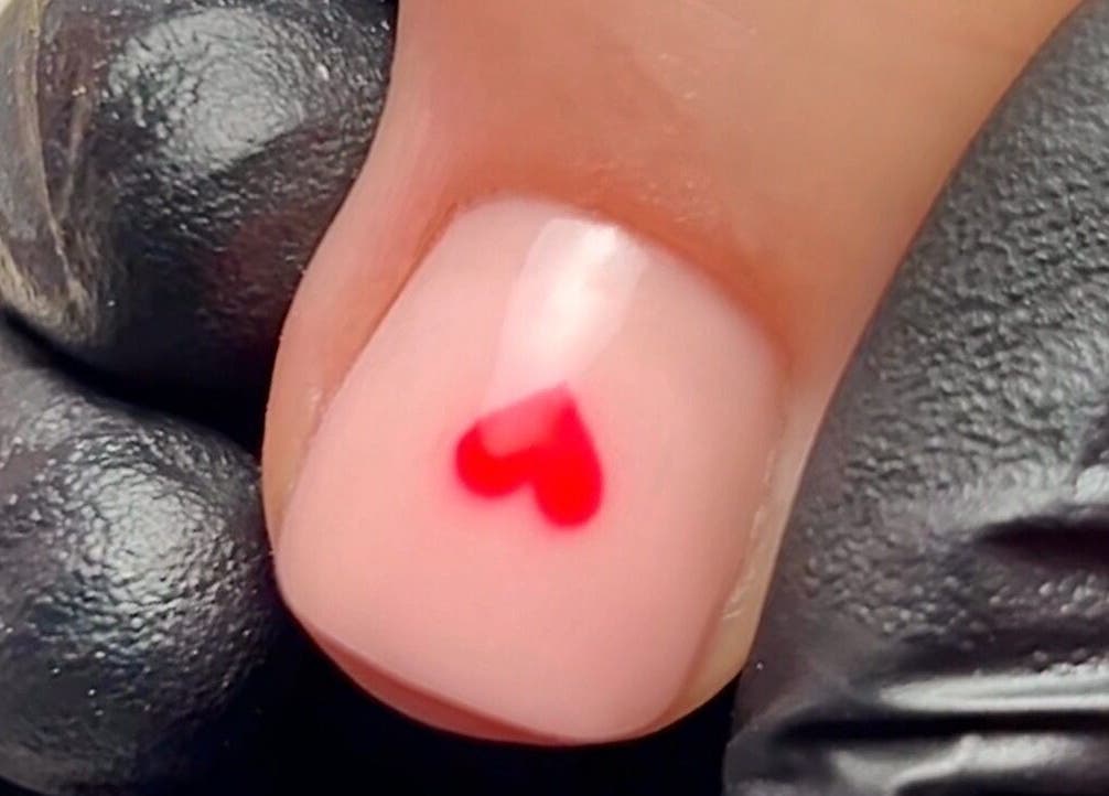 Close-up of a red heart nail art by Ocean Bloom - Troon, Camborne, England, GB.