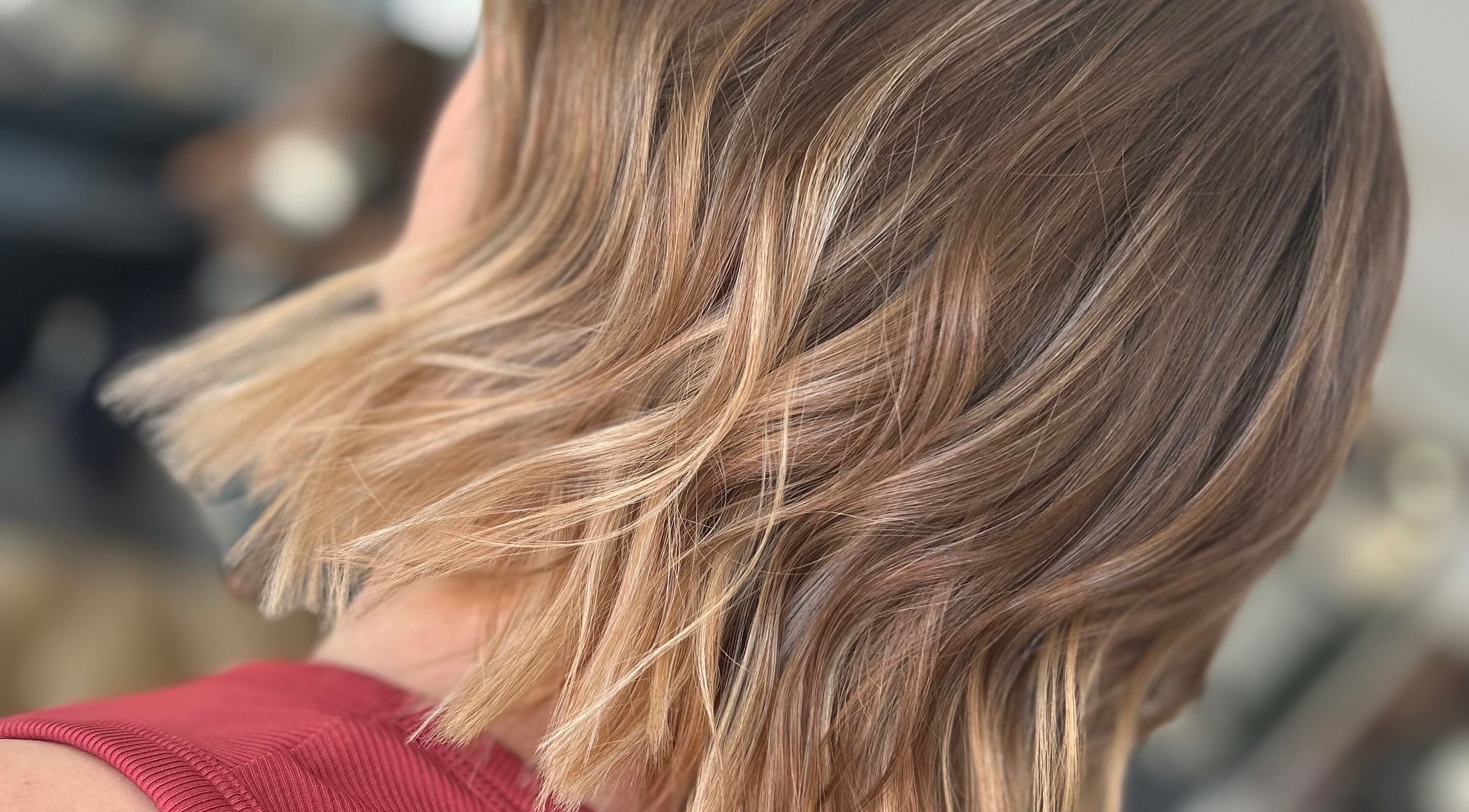Stylish wavy blonde hairstyle at KN Hair, Larrakeyah, Northern Territory, AU.