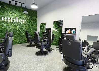 Sonder Mens | Bondi Junction salon interior with stylish chairs and lush greenery in Bondi Junction, New South Wales, AU.