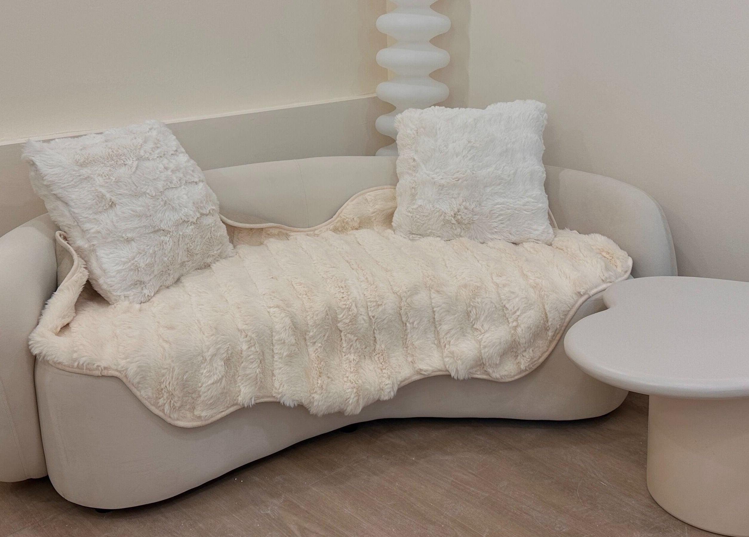 Elegant seating area at The Beauty Ritual Somerset (Killiney), Singapore, SG with plush cushions and table.