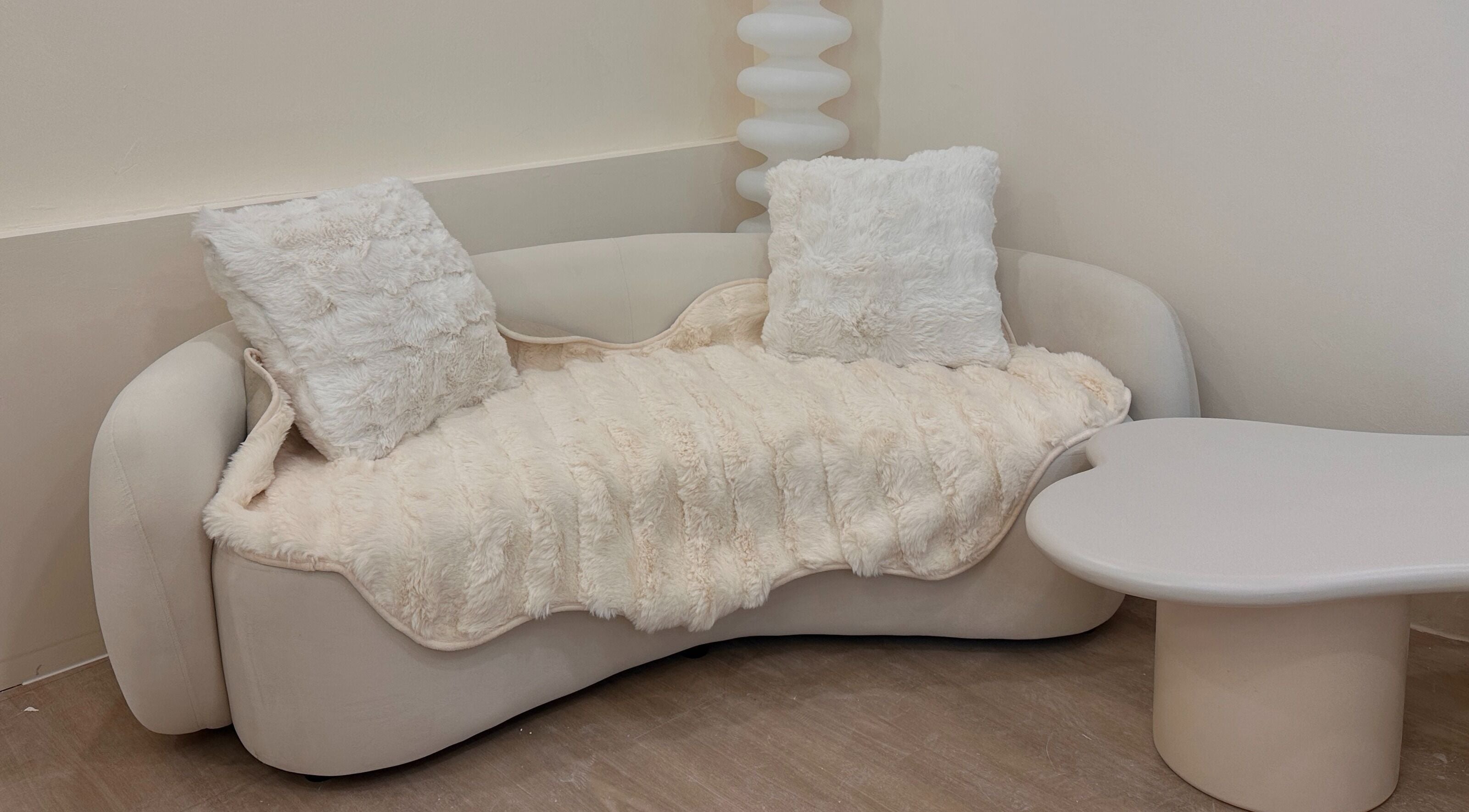 Elegant seating area at The Beauty Ritual Somerset (Killiney), Singapore, SG with plush cushions and table.