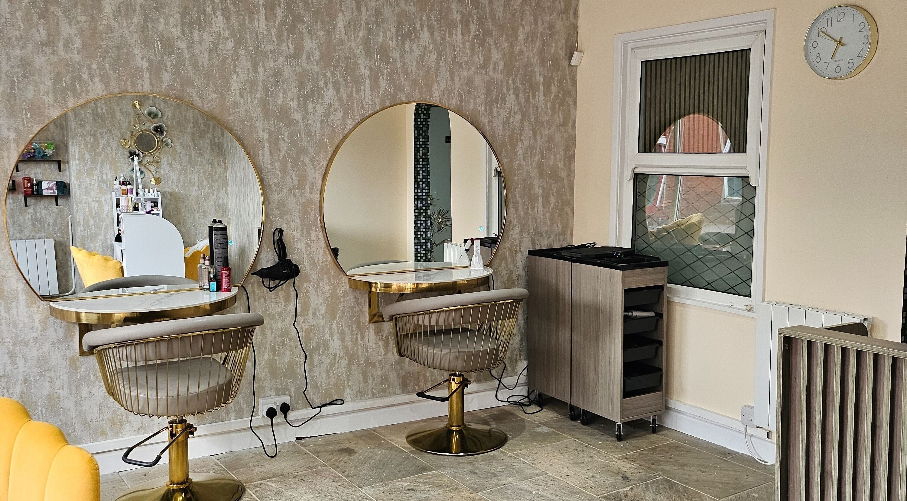 Modern salon interior with mirrors at Evolution Hair in Chorley, England, GB.