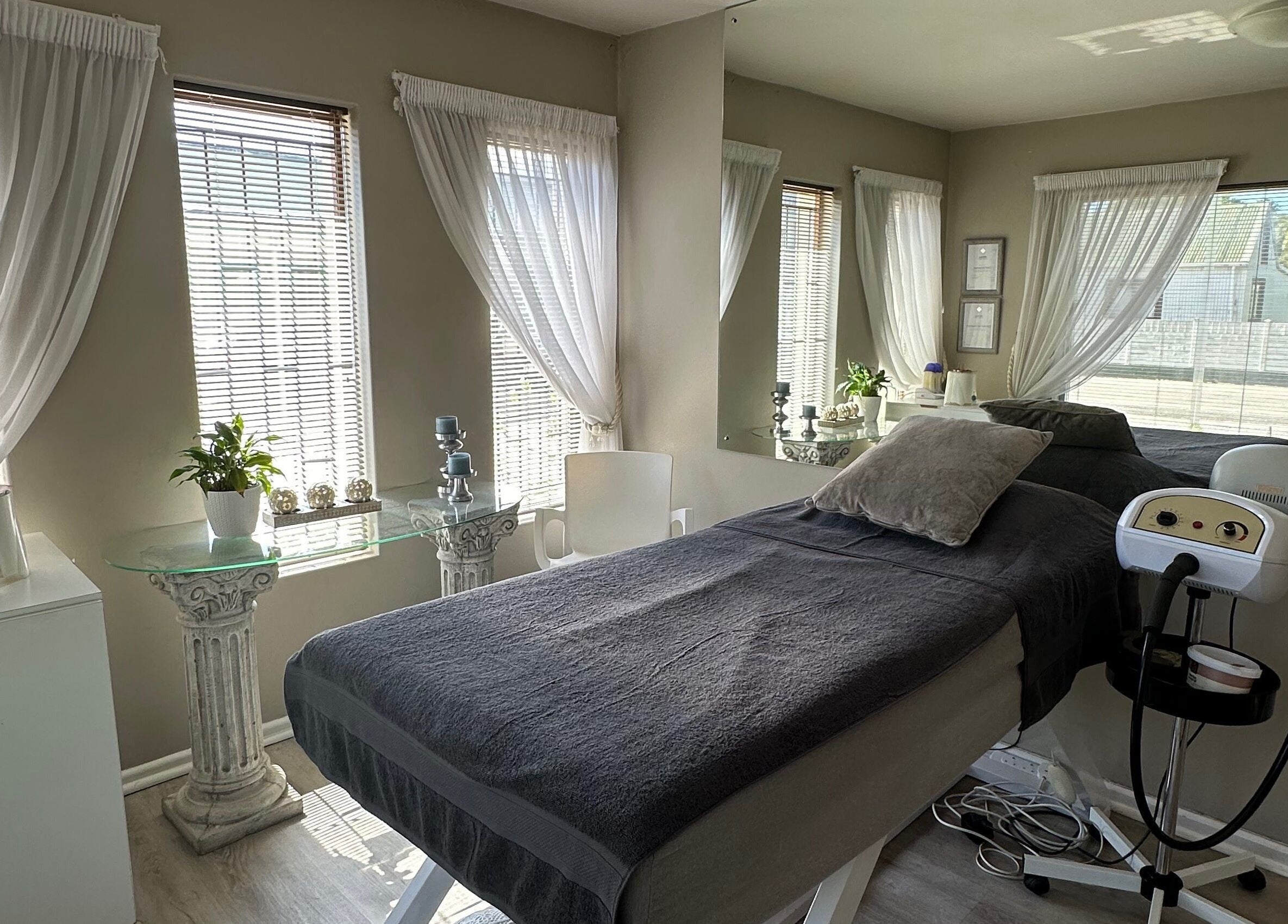 Calm treatment room at Essence in Knysna, Western Cape, ZA with massage table and soothing decor.