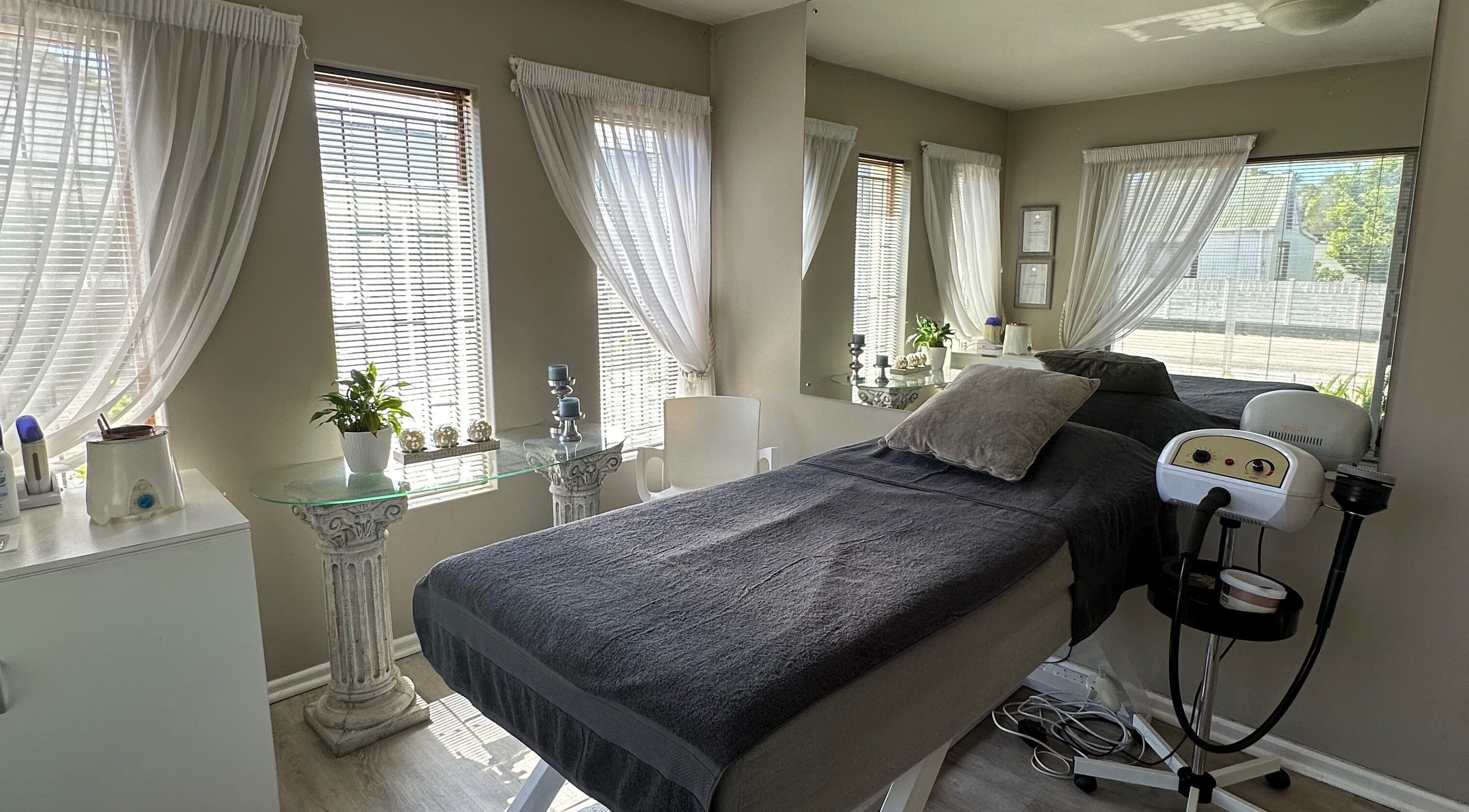 Calm treatment room at Essence in Knysna, Western Cape, ZA with massage table and soothing decor.