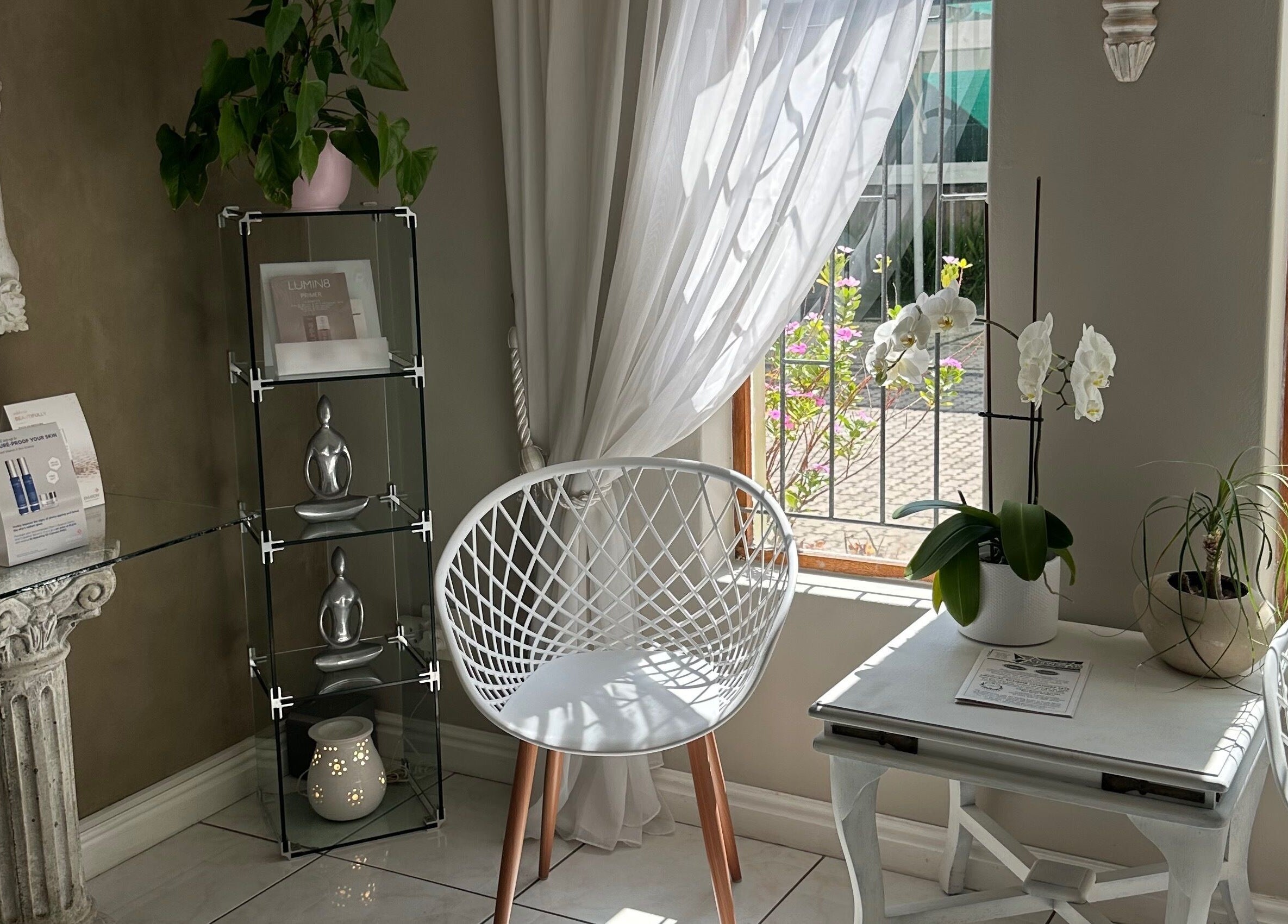 Bright seating area with orchids at Essence, Knysna, Western Cape, ZA enhancing a tranquil atmosphere.