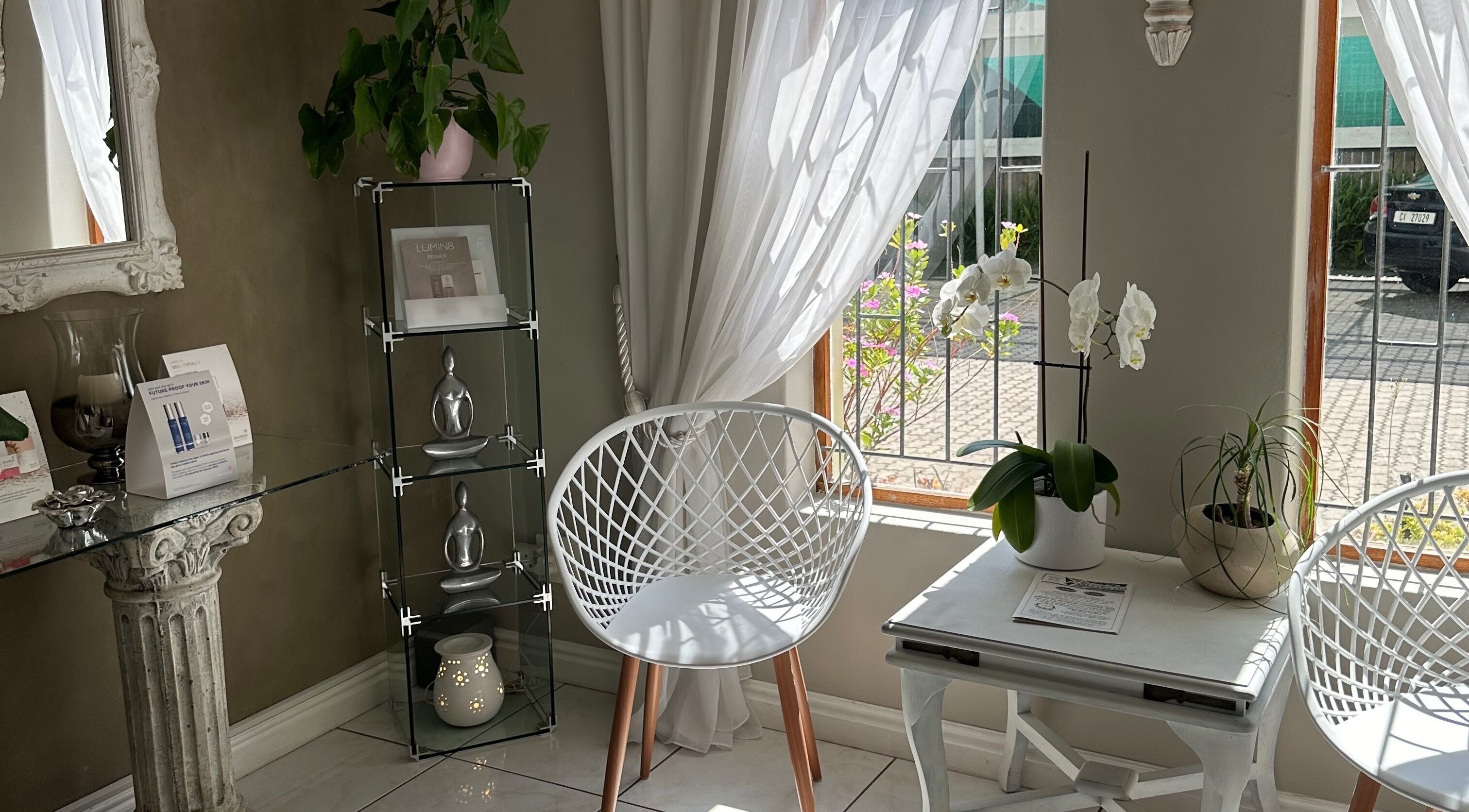 Bright seating area with orchids at Essence, Knysna, Western Cape, ZA enhancing a tranquil atmosphere.