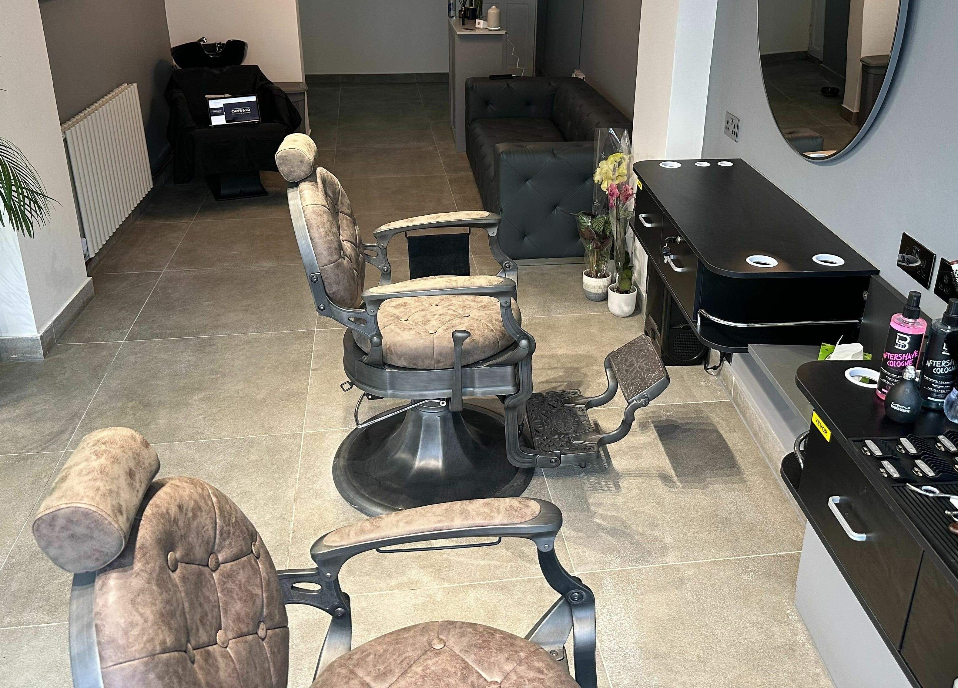 Barber chairs and styling area at Chaps Cut, Barnet, England, GB showcasing modern interior design.
