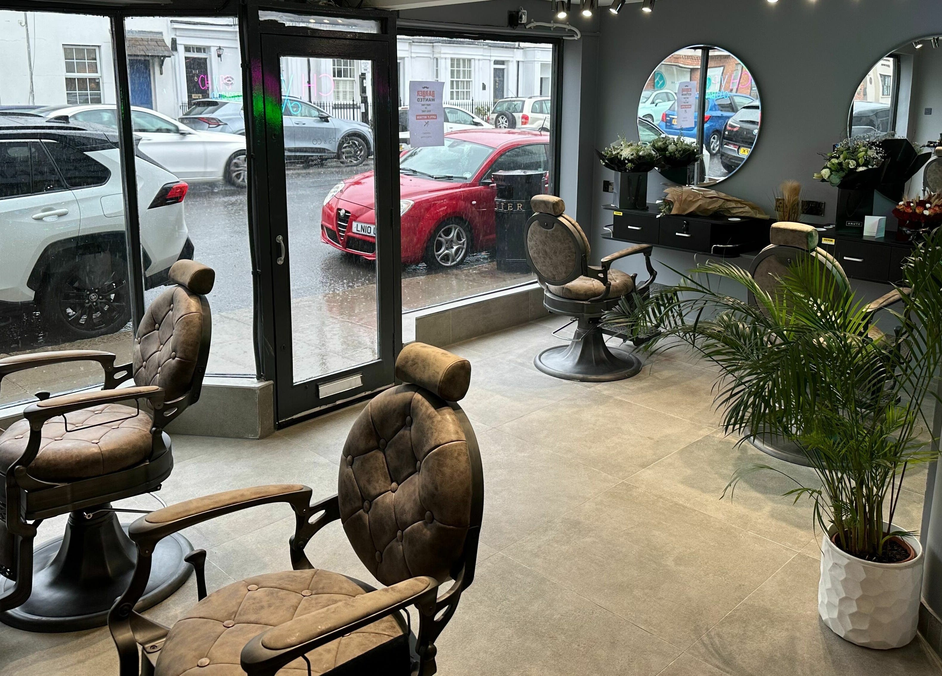 Modern barber chairs and decor at Chaps Cut, Barnet, England, GB, highlighting sleek style and comfort.