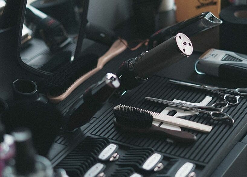 Professional styling tools at Chaps Cut, Barnet, England, GB, showcasing scissors and hair dryers.