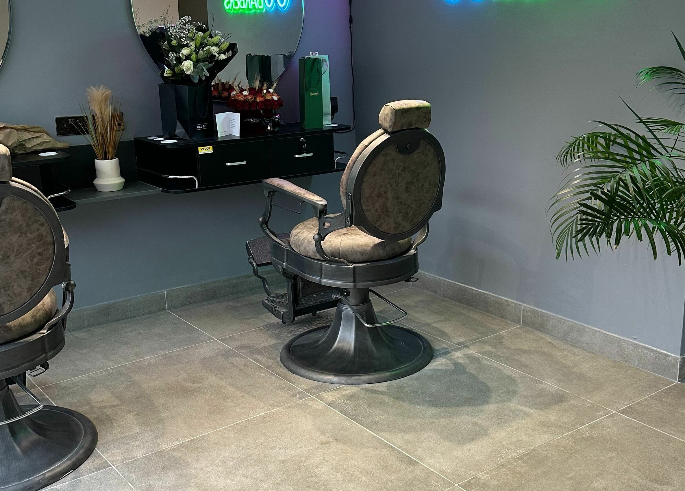 Stylish interior of Chaps Cut in Barnet, England, GB with modern barber chairs and elegant decor.